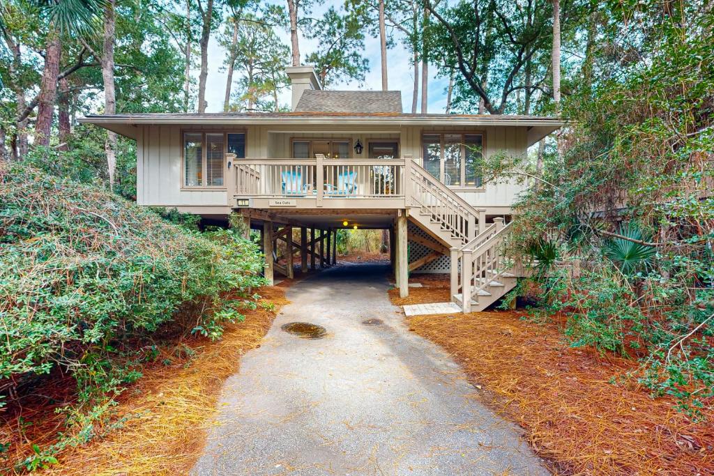 a large house with a porch and a walk way to it at Inlet Cove 11 in Kiawah Island
