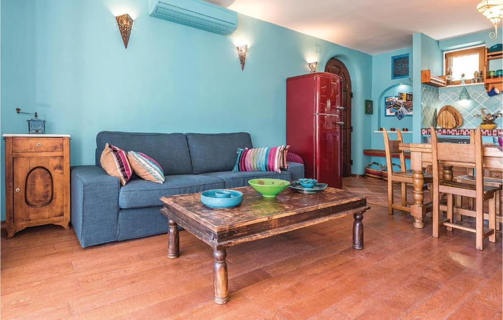 a living room with a couch and a table at Three-Bedroom Holiday Home In Zaboric in Zaboric