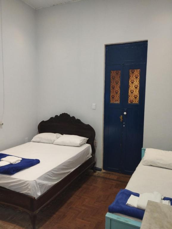 Postel nebo postele na pokoji v ubytování Pousada e Hostel Andarai
