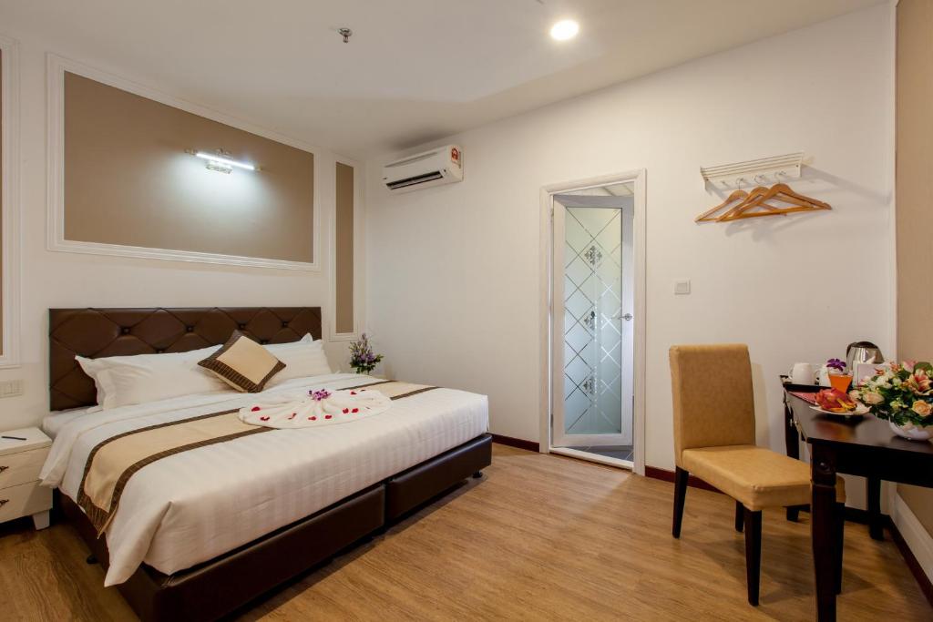 Postel nebo postele na pokoji v ubytování Koho Hotel - Johor Bahru