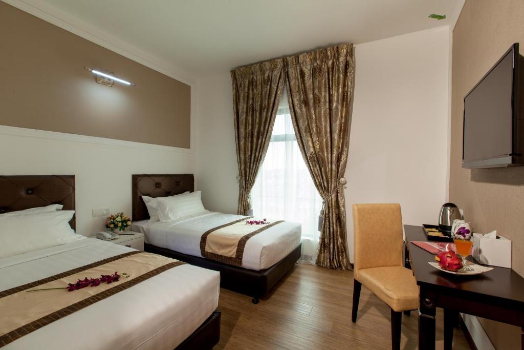 Postel nebo postele na pokoji v ubytování Koho Hotel - Johor Bahru