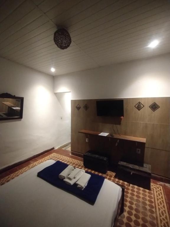 TV a/nebo společenská místnost v ubytování Pousada e Hostel Andarai