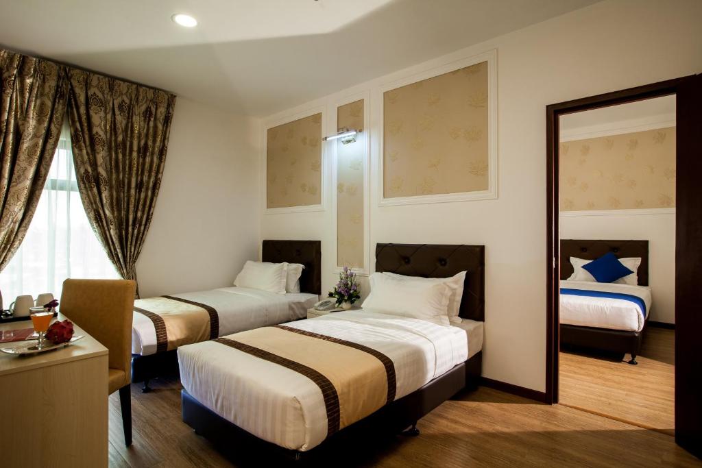 Postel nebo postele na pokoji v ubytování Koho Hotel - Johor Bahru