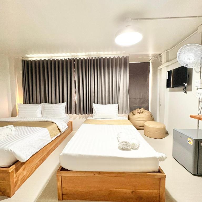 Postel nebo postele na pokoji v ubytování Yoi Hotel krabi
