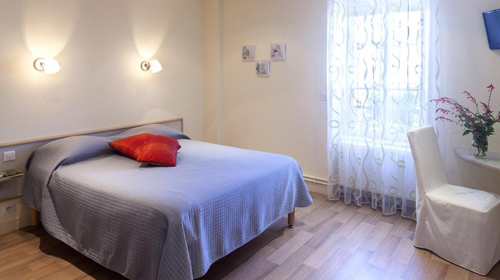 Postel nebo postele na pokoji v ubytování Logis Hôtel le Clos du Vigneron