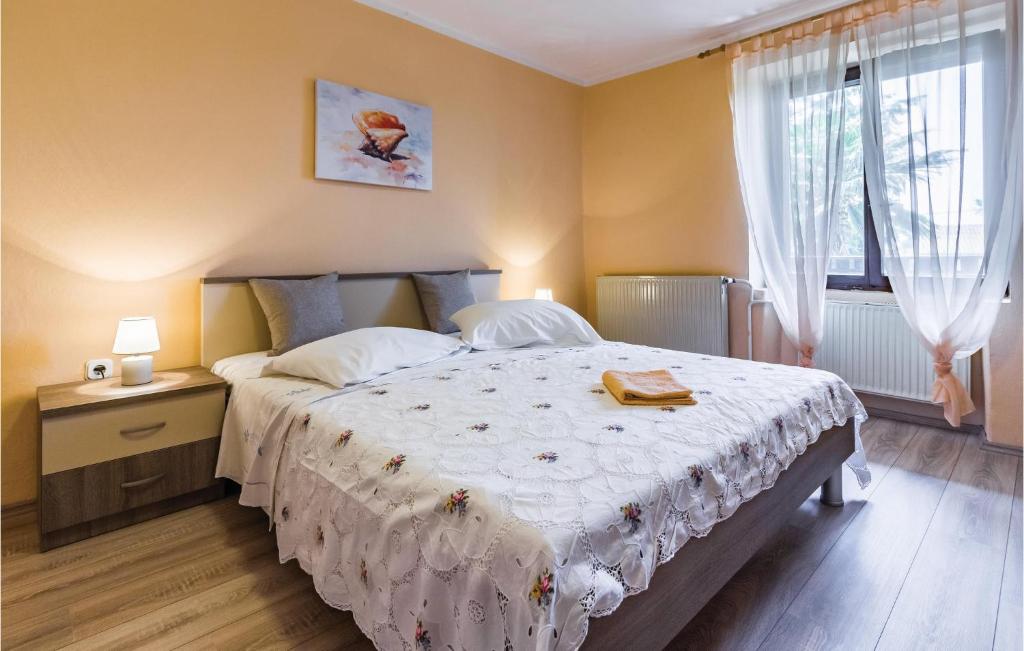 Postel nebo postele na pokoji v ubytování Holiday Home Segotici Cr