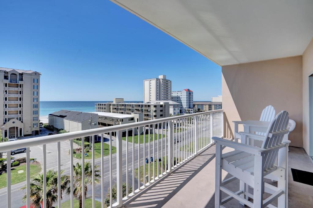 a balcony with a chair and a view of the ocean at Crystal Tower 508 by Vacation Homes Collection in Gulf Shores