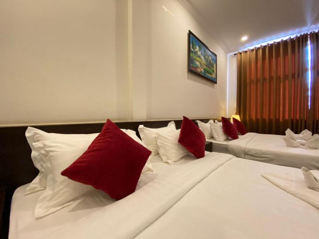 Postel nebo postele na pokoji v ubytování Apple Hotel Two - Near Phnom Penh Airport