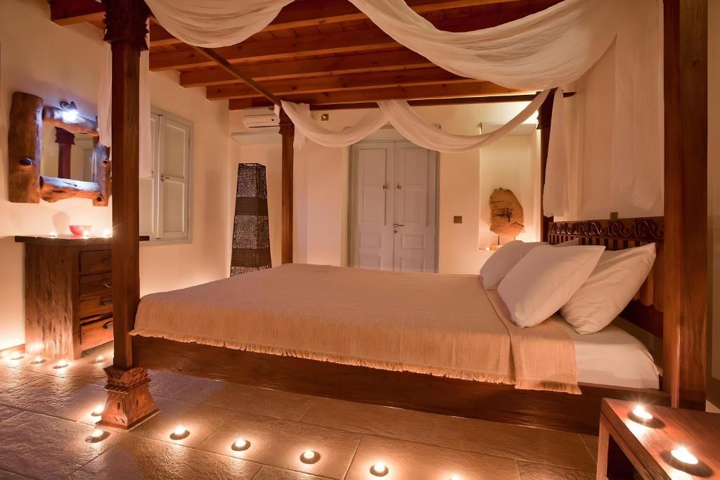 Postel nebo postele na pokoji v ubytování Santanna Suites