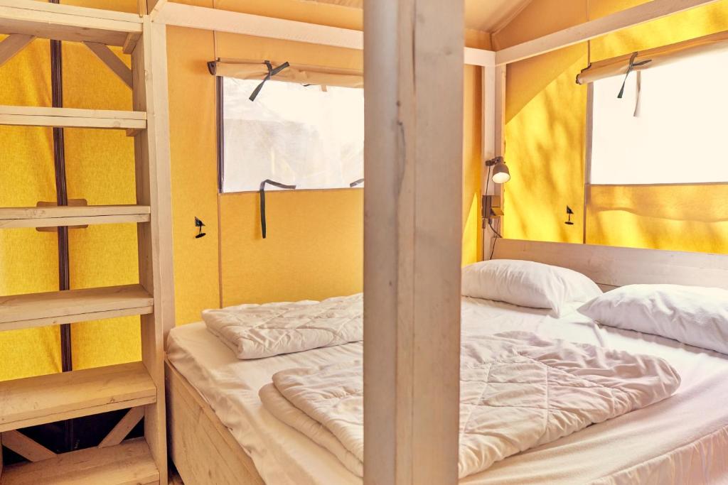 Postel nebo postele na pokoji v ubytování Glamping Virton