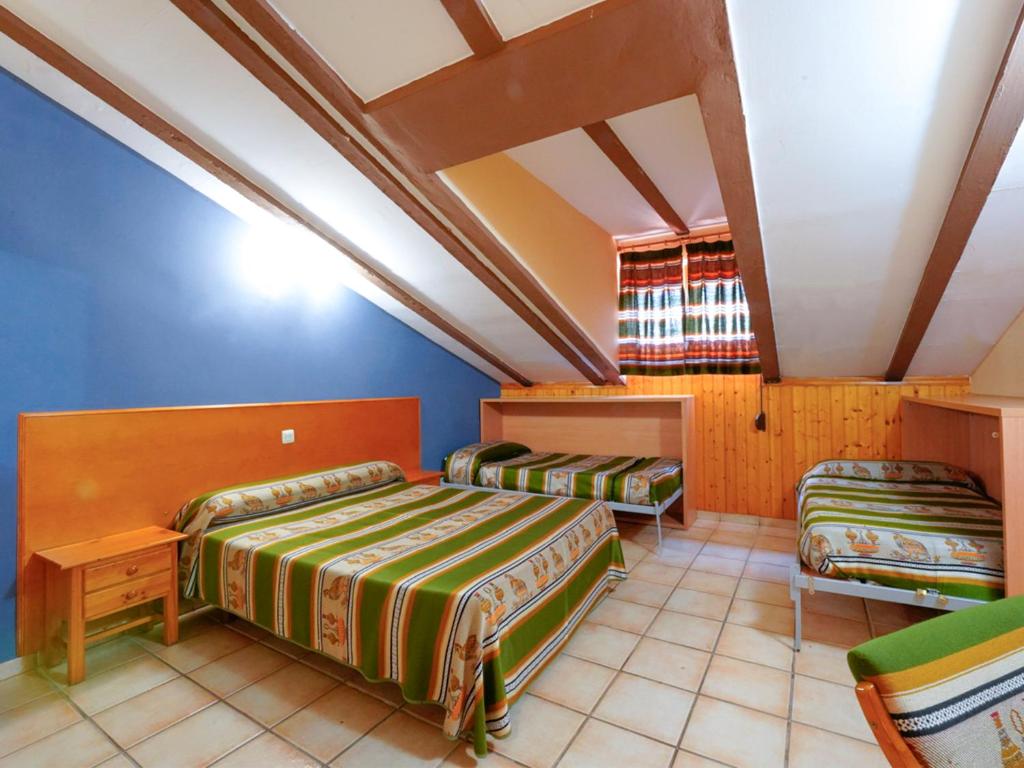 Postel nebo postele na pokoji v ubytování Hotel La Rueda 3000