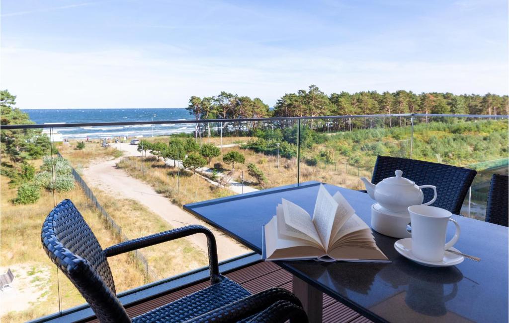a table with a book and a book on a balcony at Sunny in Binz