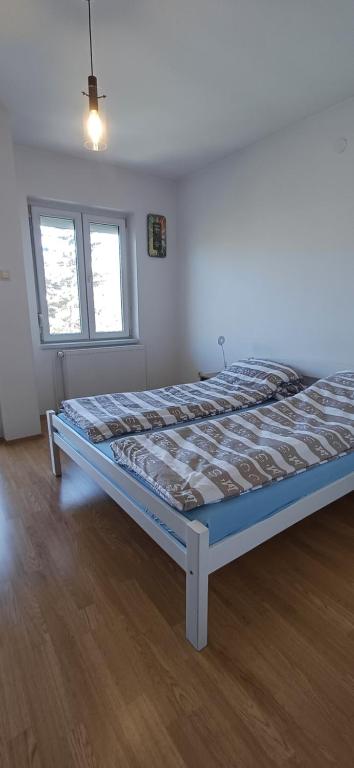 Postel nebo postele na pokoji v ubytování Sobe OLGA