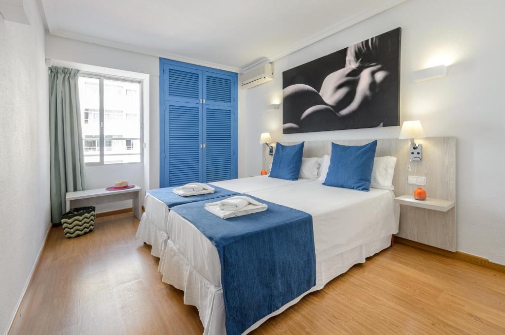Postel nebo postele na pokoji v ubytování Apartamentos Vibra Tivoli
