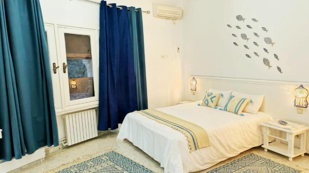 Postel nebo postele na pokoji v ubytování Dar Henani