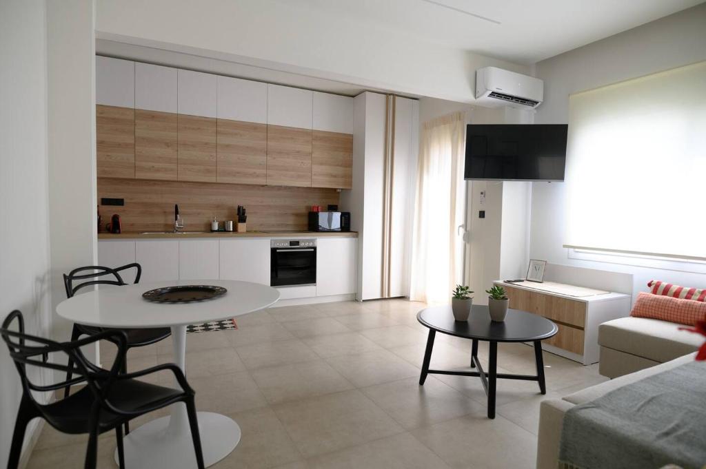 Televízia a/alebo spoločenská miestnosť v ubytovaní Lighthouse Apartments