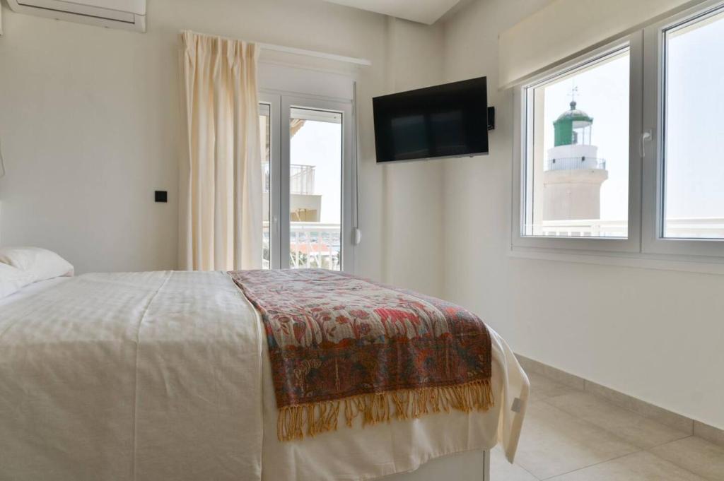 Posteľ alebo postele v izbe v ubytovaní Lighthouse Apartments