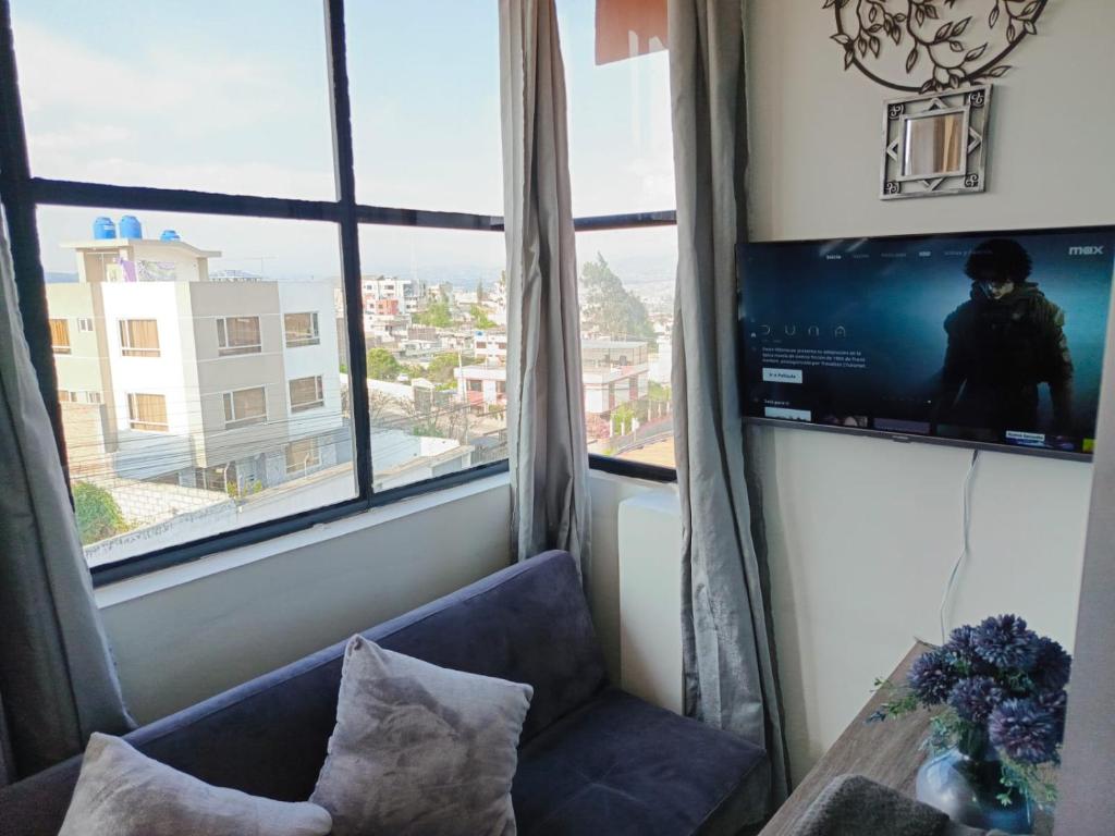 TV a/nebo společenská místnost v ubytování Hotel Ciudad Ambato