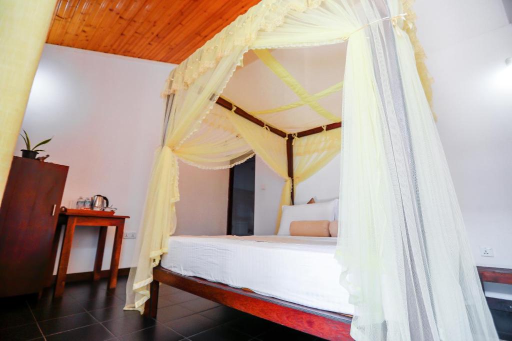Postel nebo postele na pokoji v ubytování Mel's Inn