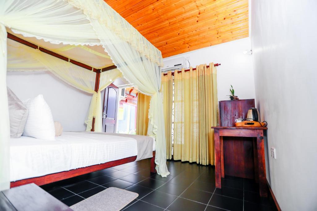 Postel nebo postele na pokoji v ubytování Mel's Inn