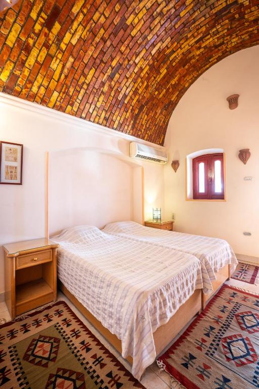 Postel nebo postele na pokoji v ubytování villa al diwan luxor