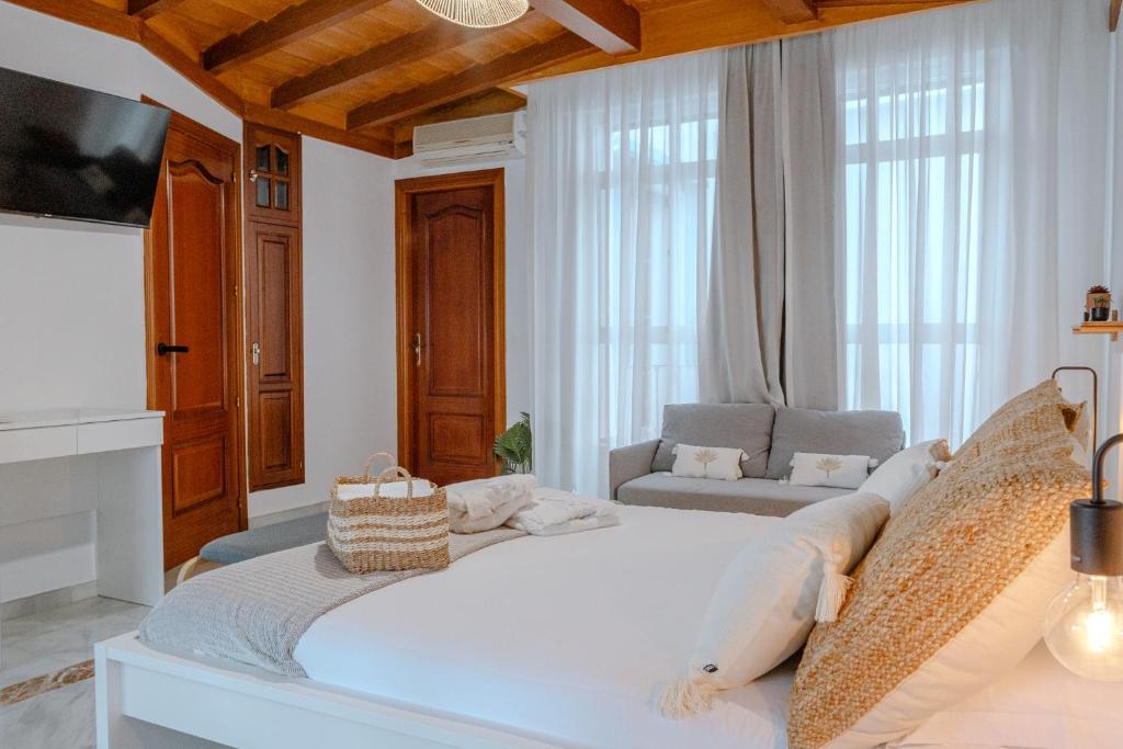 Cama o camas de una habitación en El Mirador De La Consentida Rooms & Suites Boutique