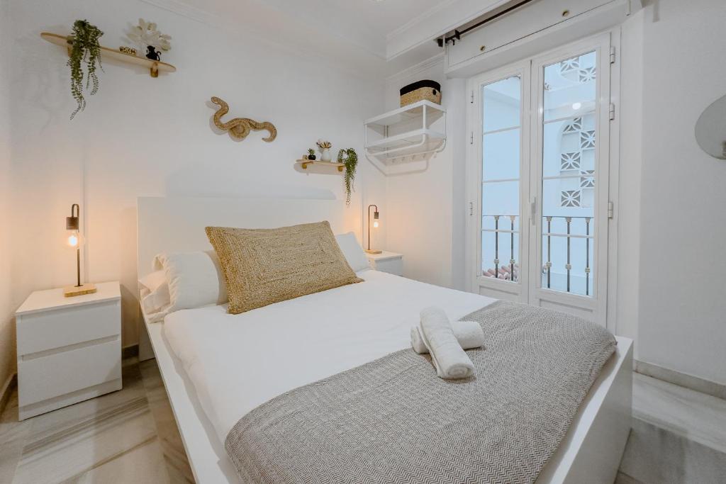 Cama o camas de una habitación en El Mirador De La Consentida Rooms & Suites Boutique