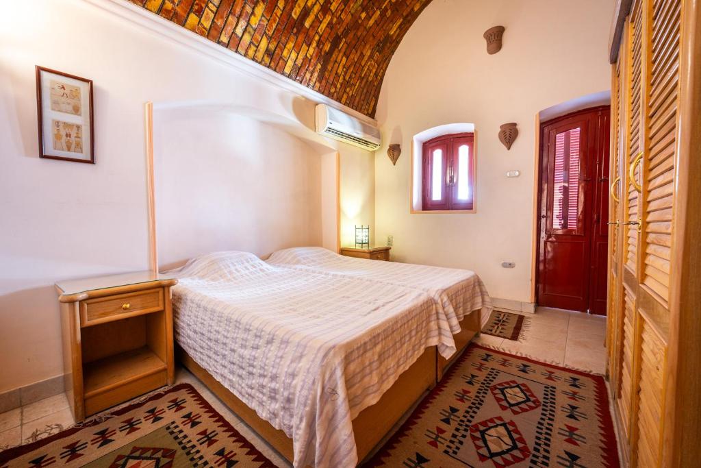 Postel nebo postele na pokoji v ubytování villa al diwan luxor