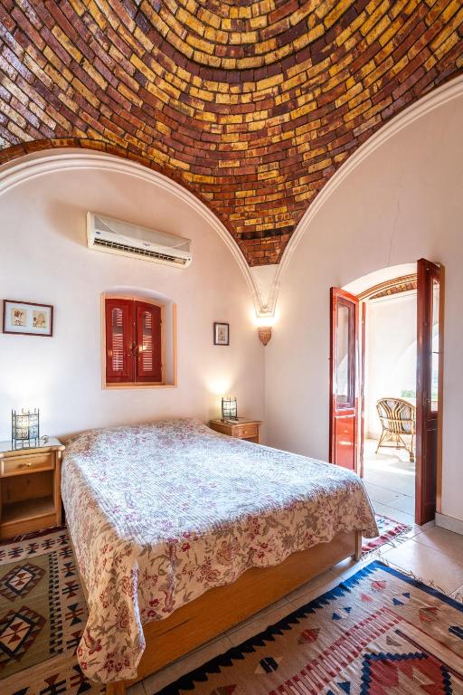 Postel nebo postele na pokoji v ubytování villa al diwan luxor