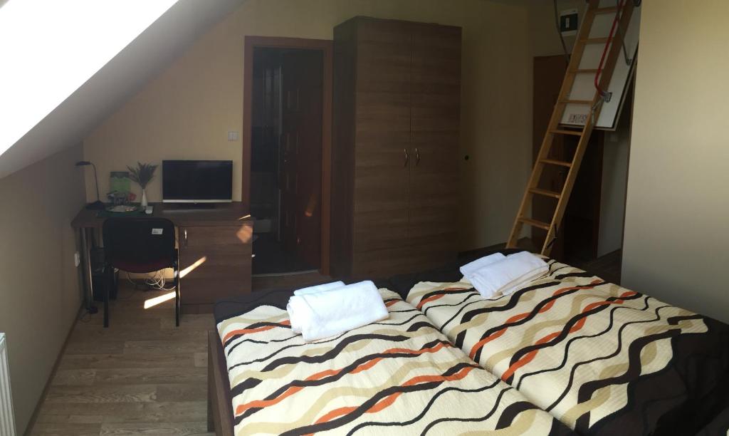 Postel nebo postele na pokoji v ubytování Penzion Toscana