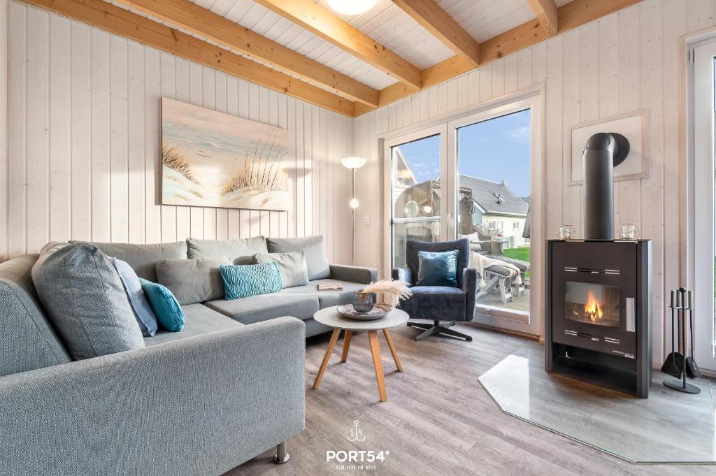 Posezení v ubytování Ferienhaus Huus Luv