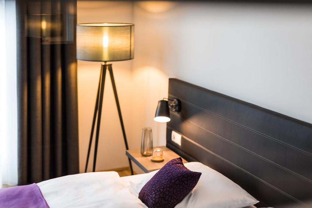 Postel nebo postele na pokoji v ubytování Hotel K99