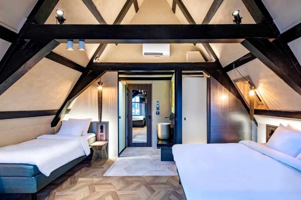 Postel nebo postele na pokoji v ubytování Mister Highland Hotel