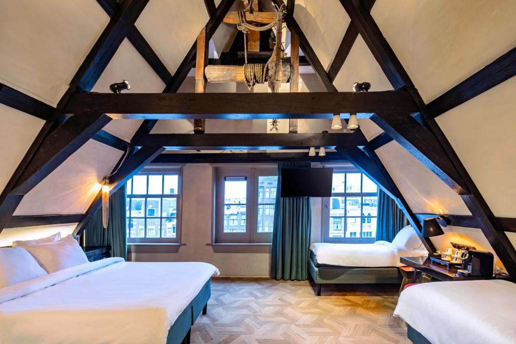 Postel nebo postele na pokoji v ubytování Mister Highland Hotel
