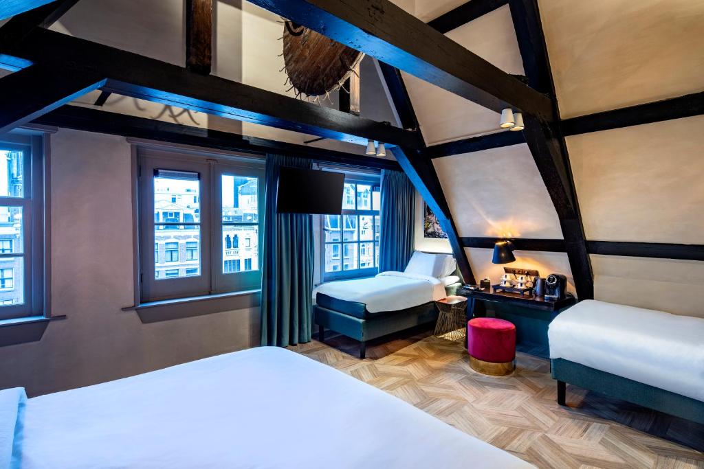 Postel nebo postele na pokoji v ubytování Mister Highland Hotel