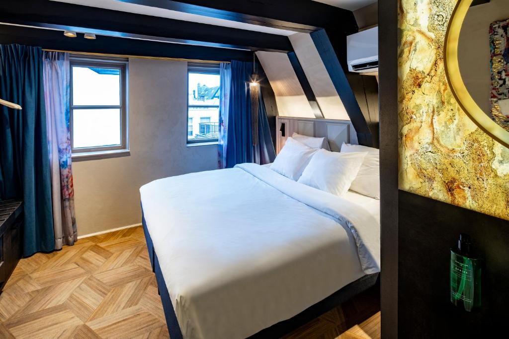 Postel nebo postele na pokoji v ubytování Mister Highland Hotel