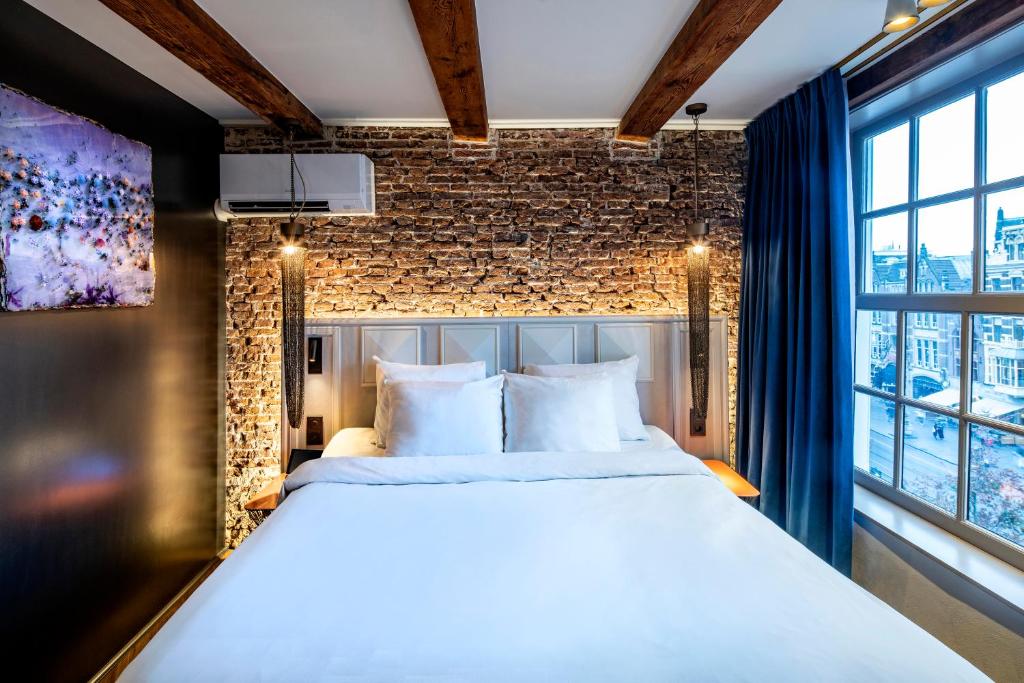 Postel nebo postele na pokoji v ubytování Mister Highland Hotel