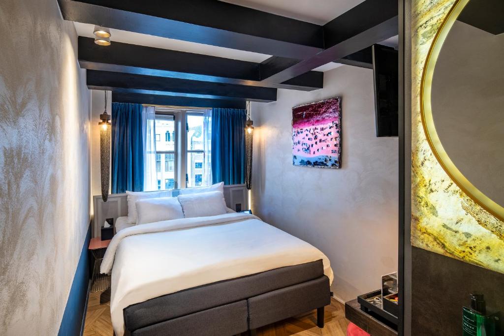 Postel nebo postele na pokoji v ubytování Mister Highland Hotel
