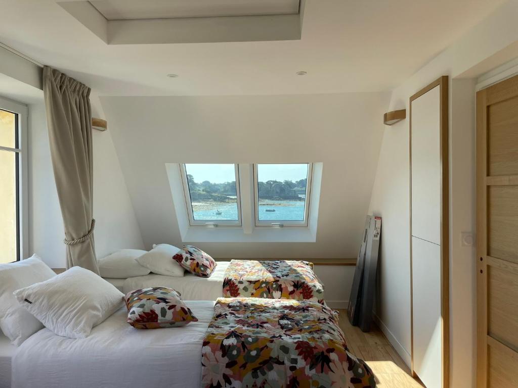 Postel nebo postele na pokoji v ubytování Bréhat Vue Mer - Villa San Denn