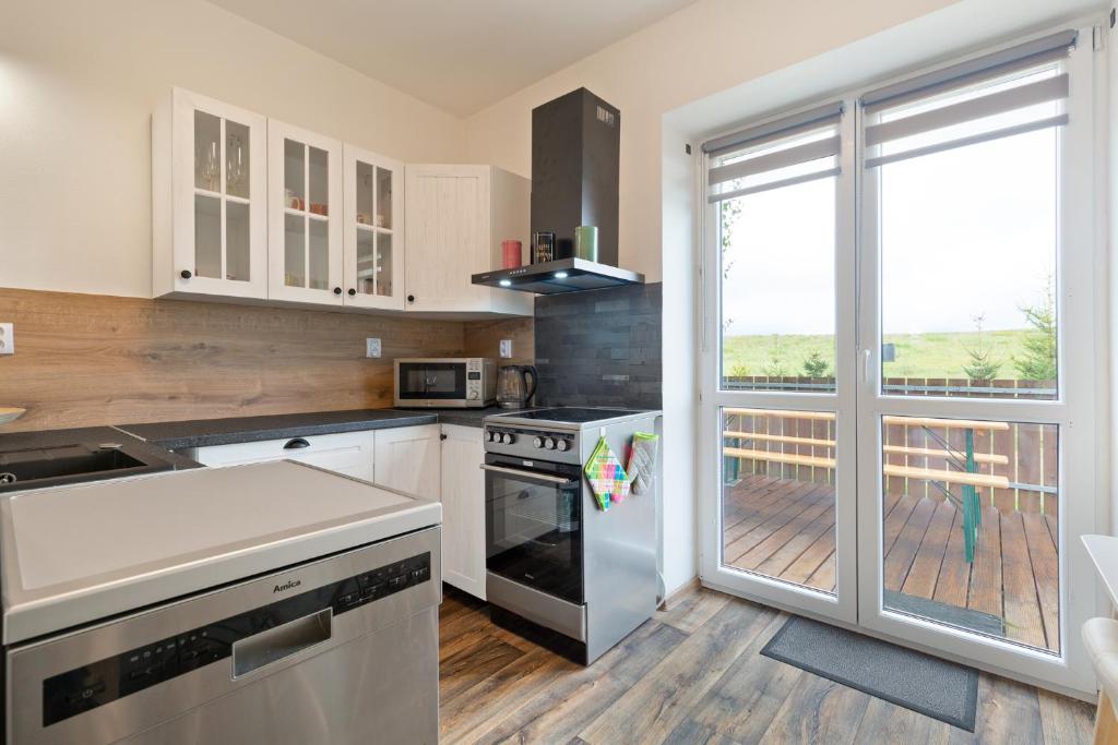 Kuchyň nebo kuchyňský kout v ubytování Home Dalov