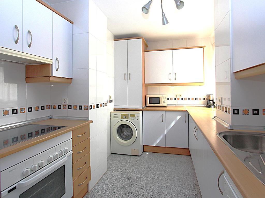 Kuchyň nebo kuchyňský kout v ubytování Luxury Apartment Holiday Rental Ne