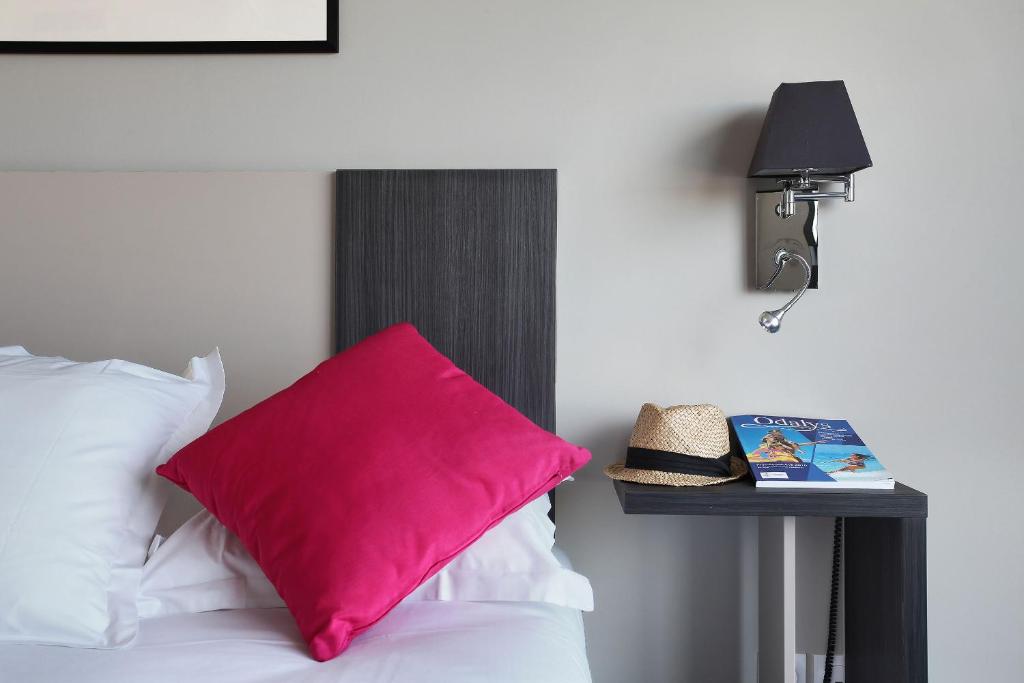 Postel nebo postele na pokoji v ubytování Appart'hôtel Odalys City - Marseille Prado
