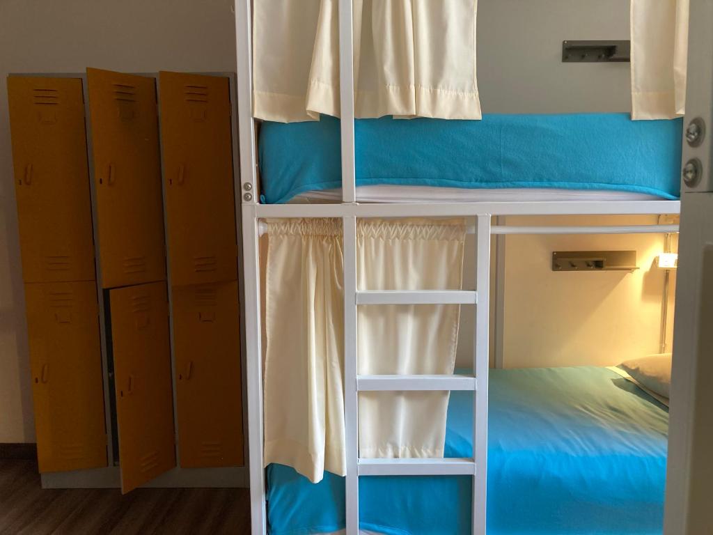 Postel nebo postele na pokoji v ubytování Hostal Macondo Bogotá