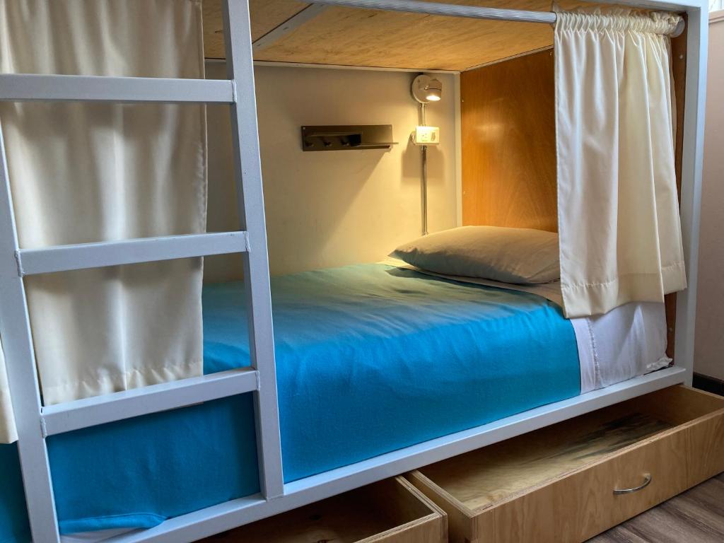 Postel nebo postele na pokoji v ubytování Hostal Macondo Bogotá