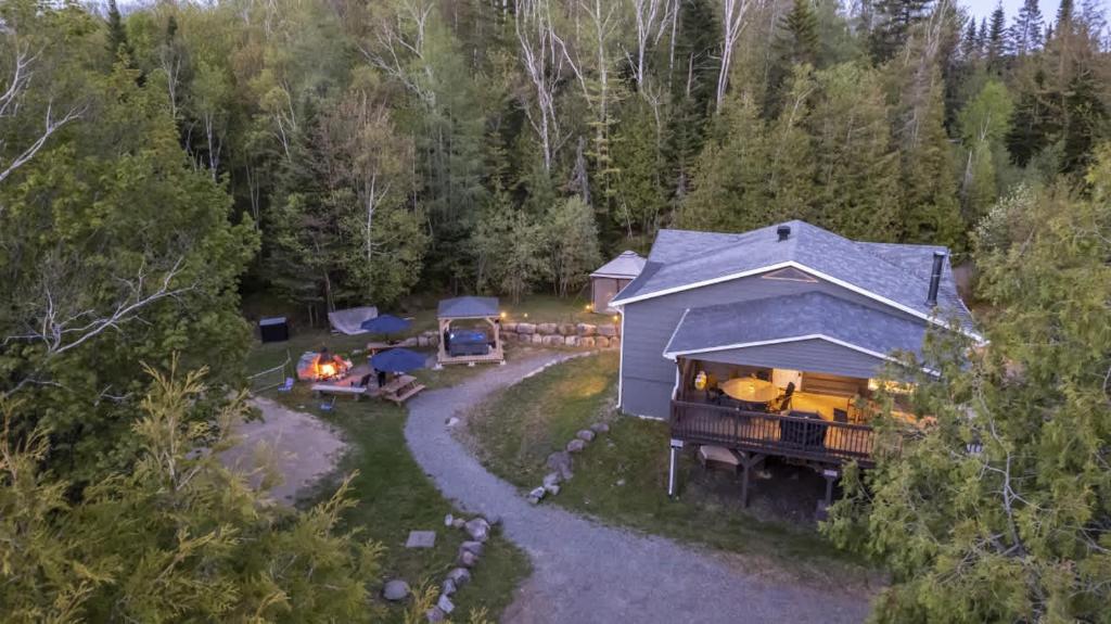 an aerial view of a house in the woods at Entre Monts et Lac - lac - Lake front & Volleyball in Saint Adolphe D'Howard