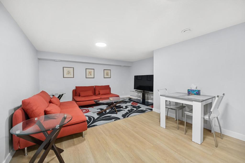 a living room with a couch and a table at Flora's House in Calgary