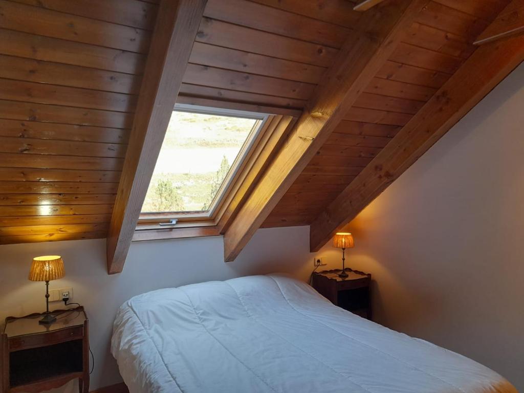 Posteľ alebo postele v izbe v ubytovaní Dúplex con moderna y amplia cocina Erta 6