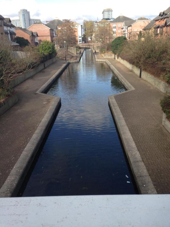 a canal of water with buildings in the background at Cardiff 3Bed House-FreeParking-15MinWalkToStadium in Cardiff