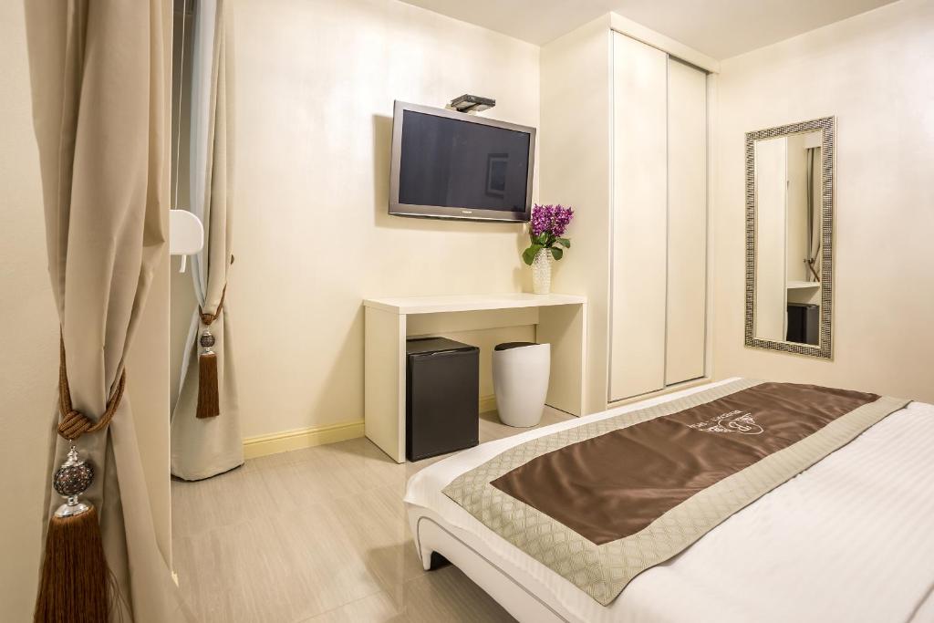 TV a/nebo společenská místnost v ubytování Guest House Benedict
