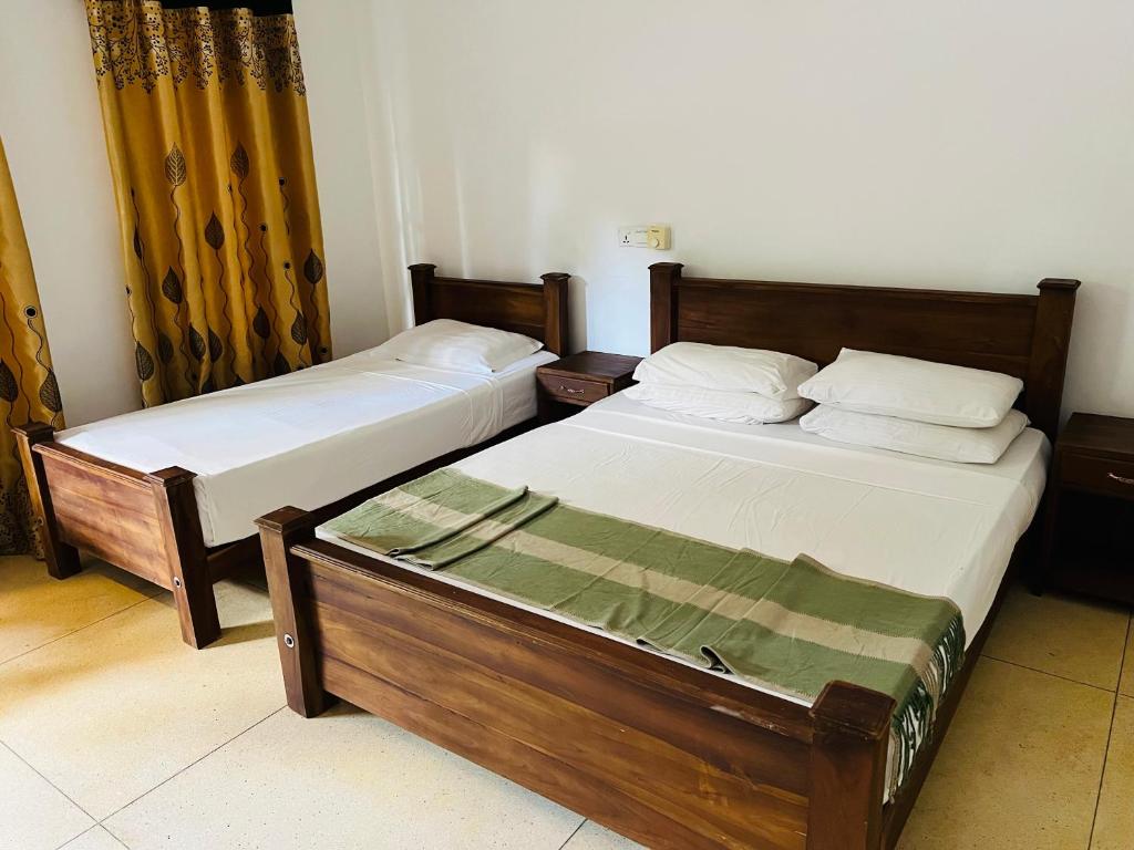 Postel nebo postele na pokoji v ubytování Kingfisher Resort & Retreat Sigiriya